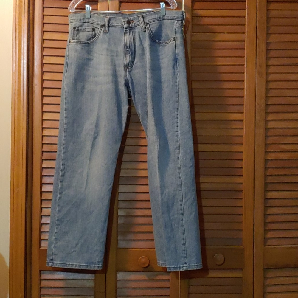 Light colored wrangler work jeans.